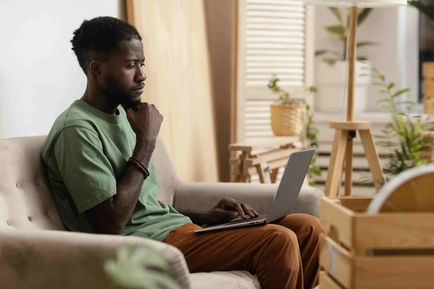 A telehealth therapy session on a laptop at home